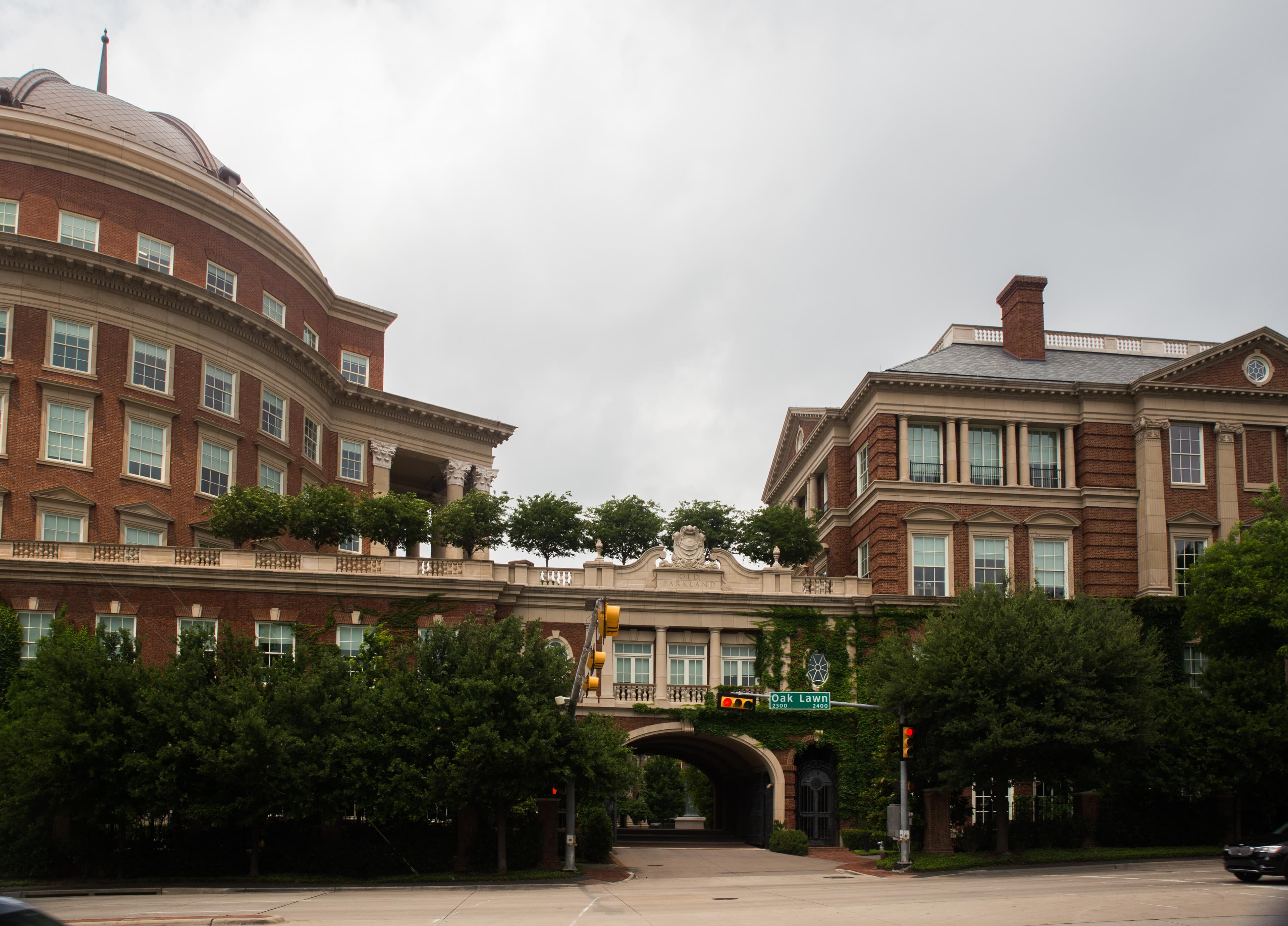 The restored Old Parkland Hospital building in Dallas — a brick-and-dome civic structure with classical columns, photographed under a soft sky from the Oak Lawn corner of the campus where the Private Equity strategy seats itself.